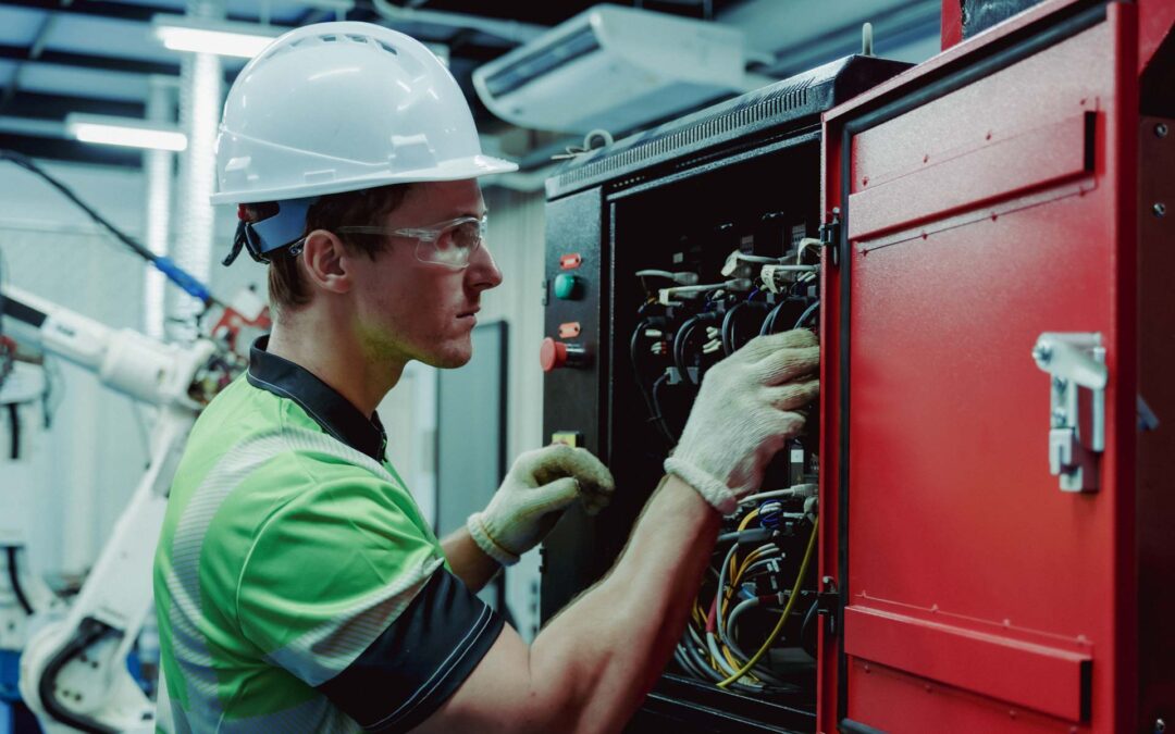 Engineer Performing Electrical Inspection And Maintenance On Industrial Control Cabinet During Smart Factory Automation Operation Ensuring System Stability And Safety Standards